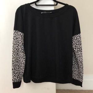 sweater with cheetah sleeves